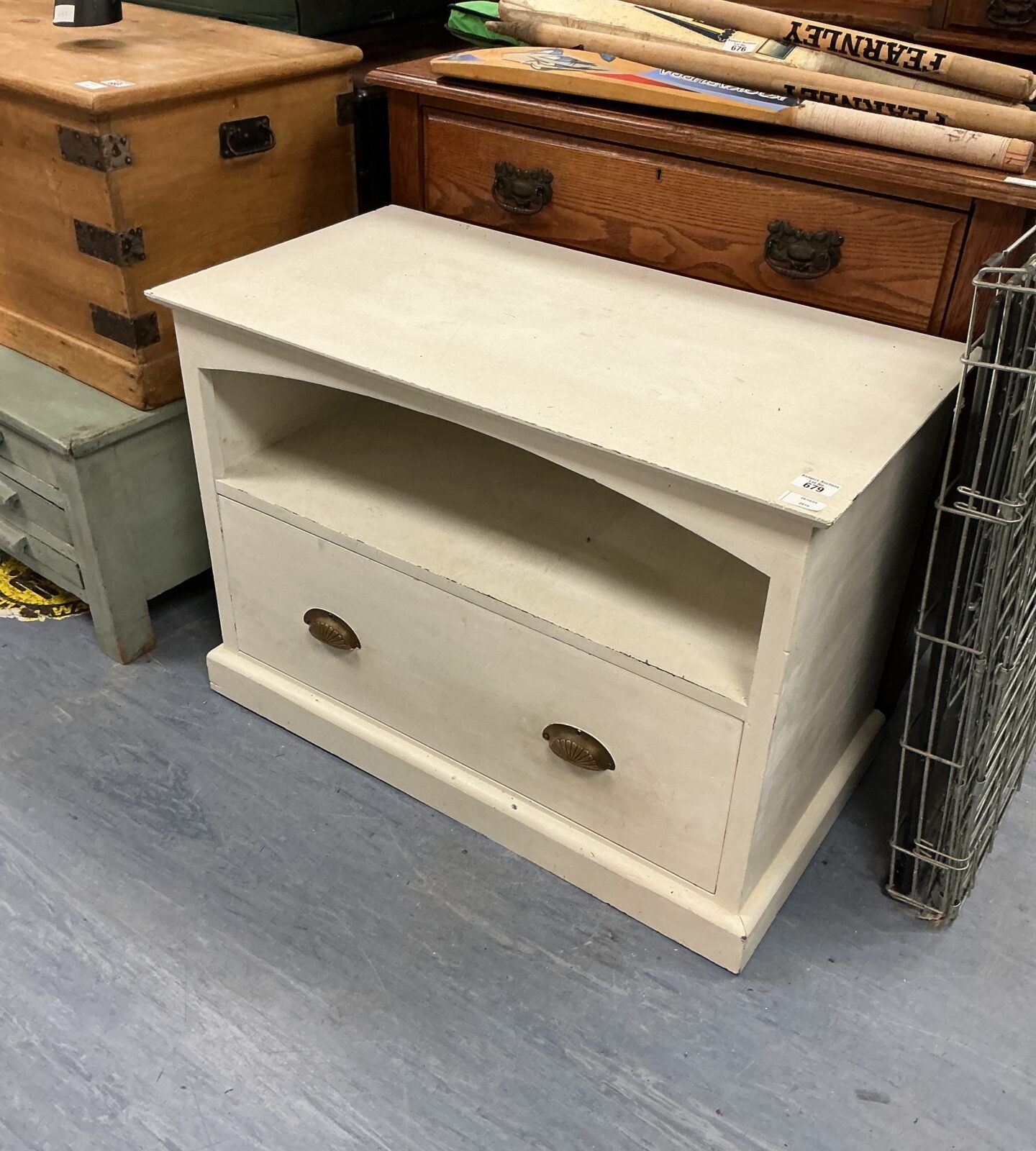 Vintage wooden storage unit with a single door, ideal for farmhouse style.