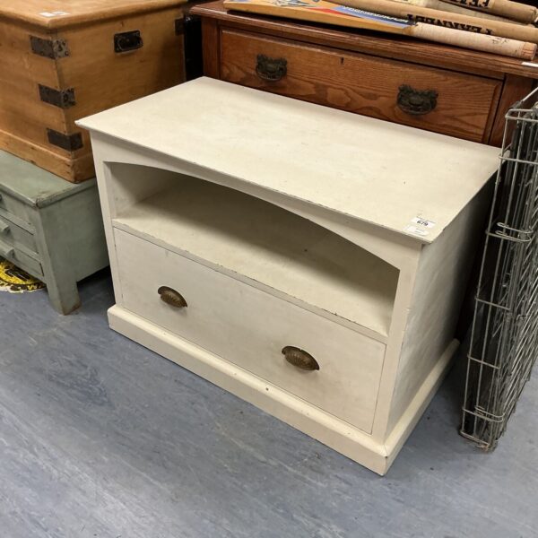 Vintage wooden storage unit with a single door, ideal for farmhouse style.