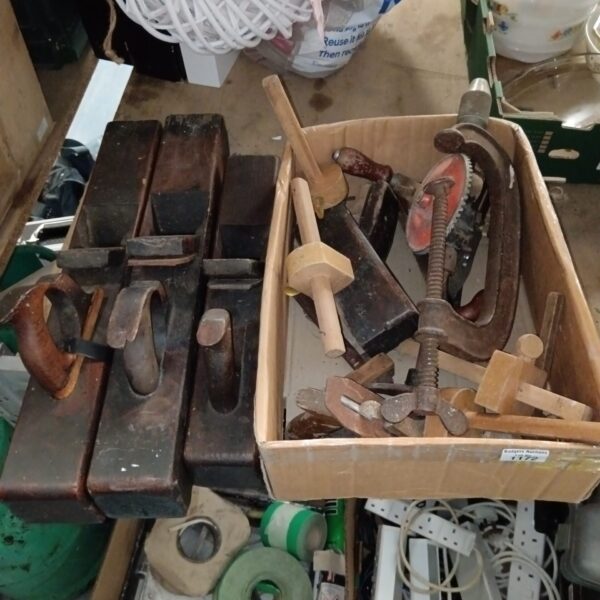 Vintage woodworking tools including block planes in a box.