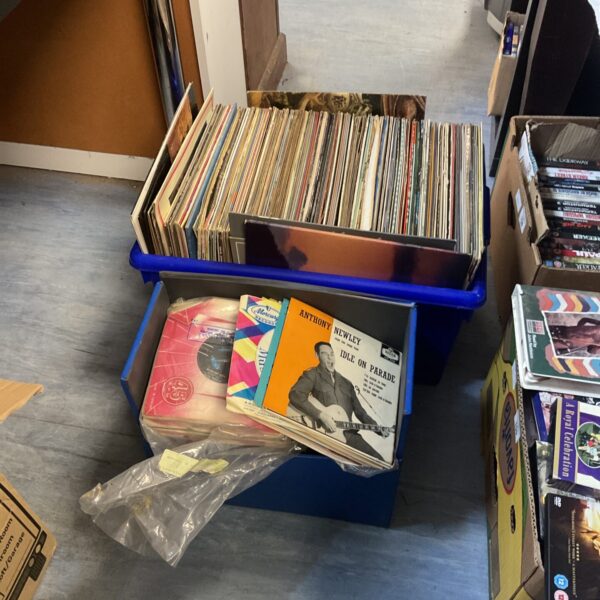 Blue case filled with a diverse lot of vinyl records.