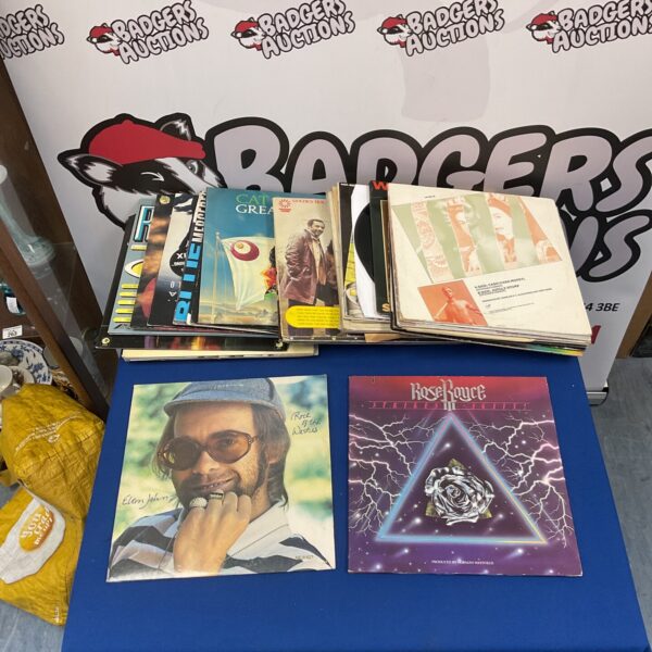 Vinyl record lot including an Elton John album for collectors.