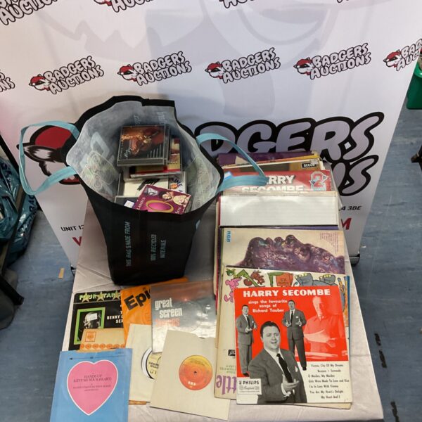 Mixed lot of vinyl records and CDs for music collectors.