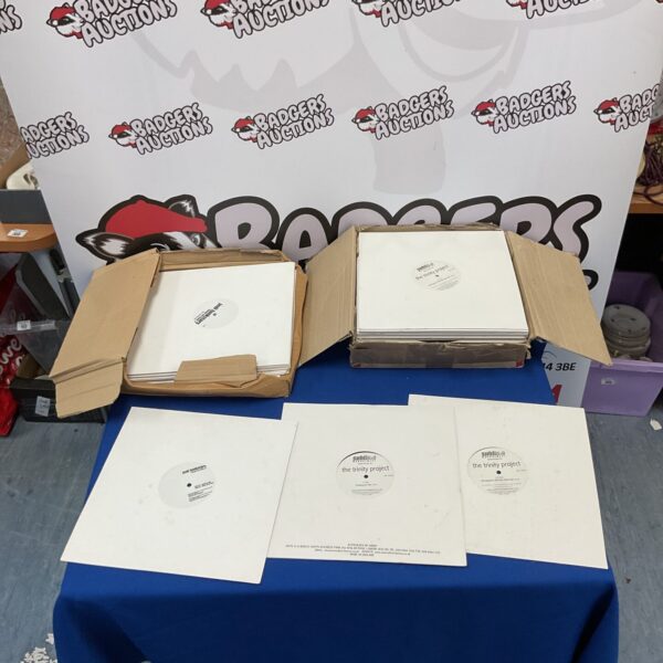 Two boxes filled with white label vinyl records for collectors.