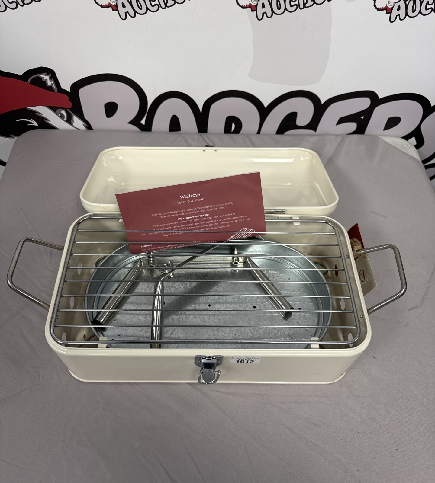 White enamel Waitrose retro barbecue with chrome handle.