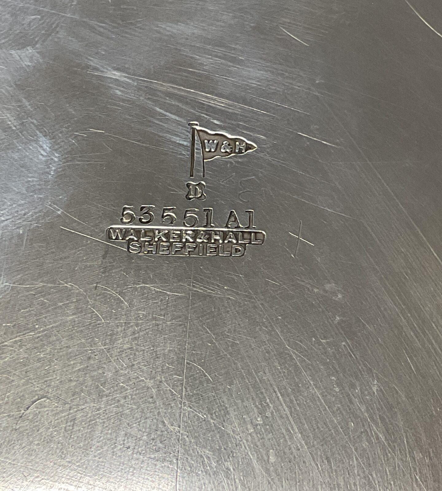 Detail of Walker and Hall silver plated salver with maker's mark.