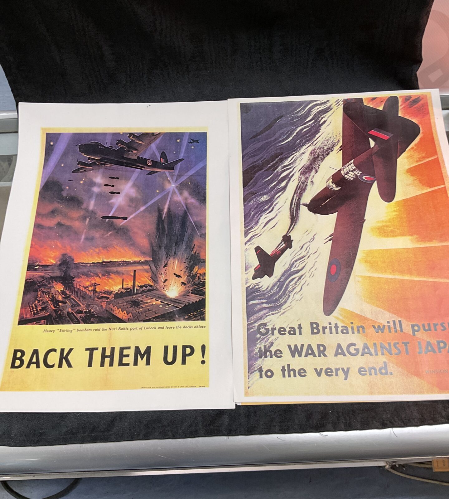 Vintage WWII British propaganda poster with fighter planes in combat.