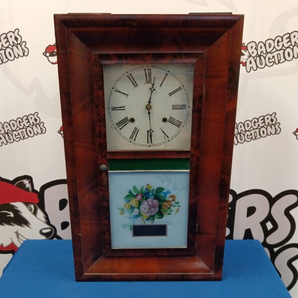 Antique Waterbury 30 hour wall clock with painted face.