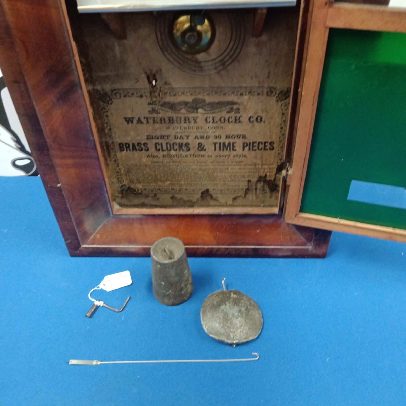 Waterbury clock movement and paper label on back.