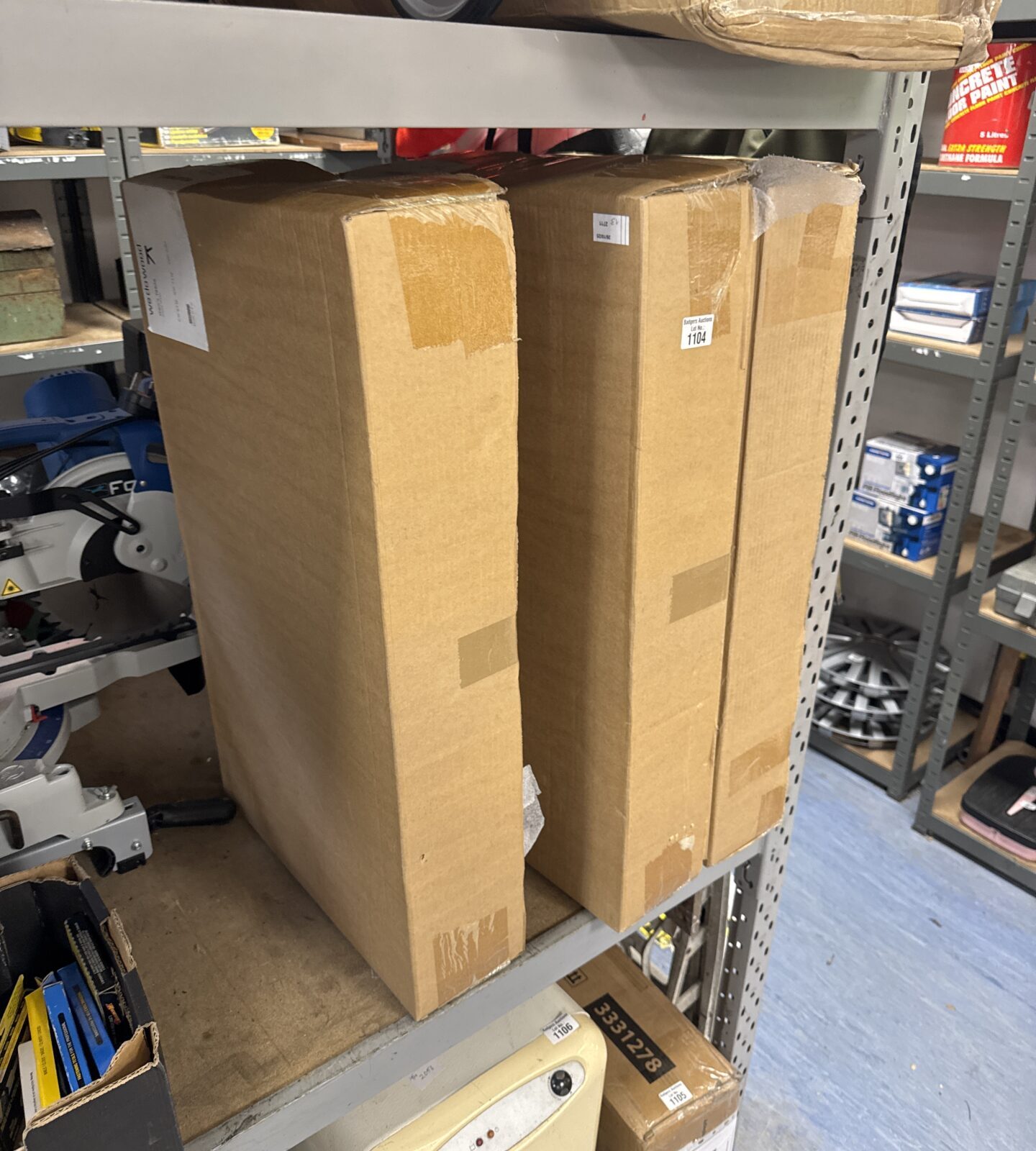 Stack of three new we do wood geo tables in green boxes.
