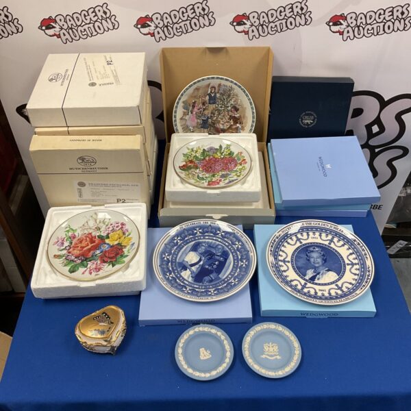 Collection of Wedgwood and Hutschenreuter collectors plates for display.