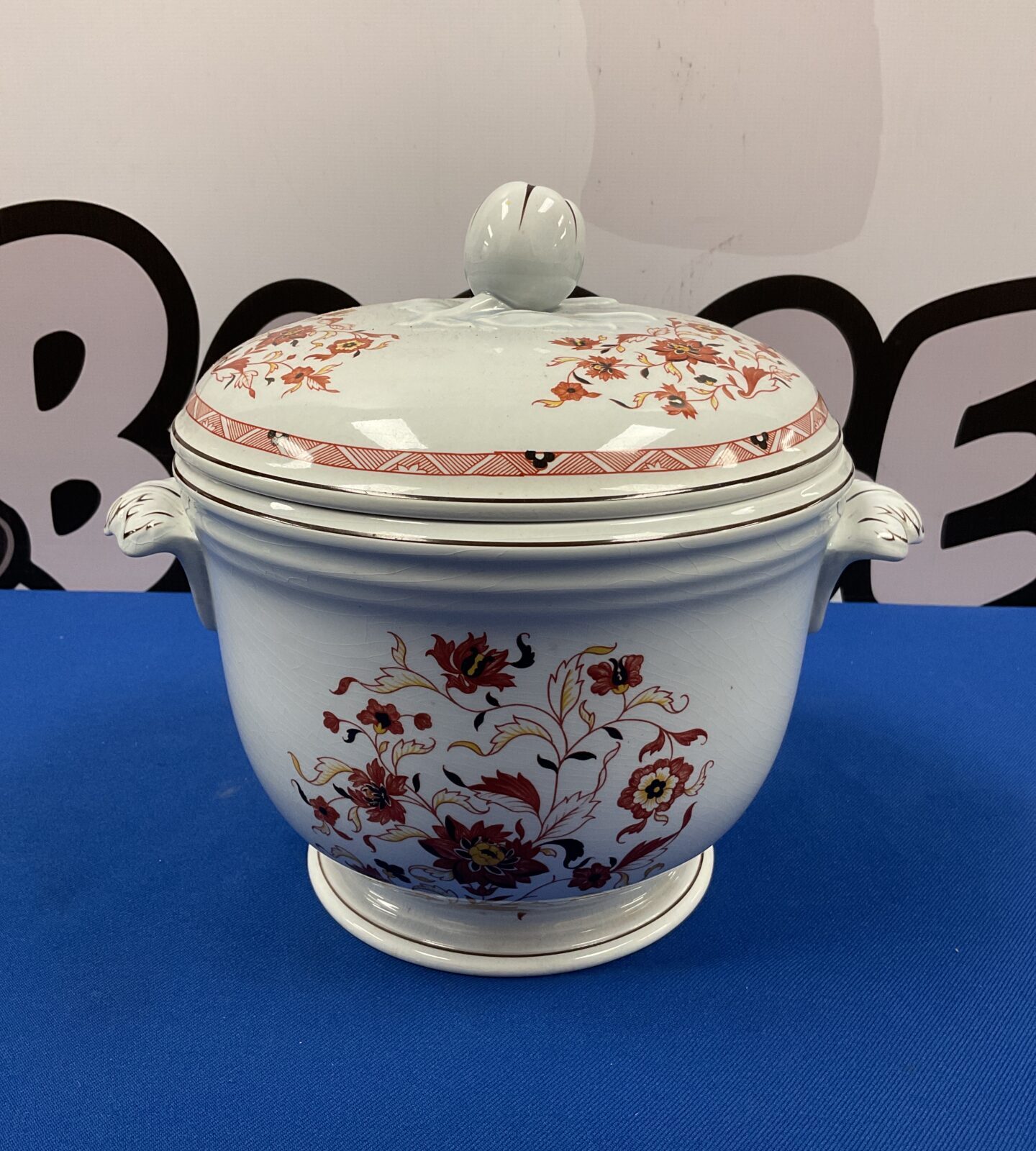 Side view of a vintage Wedgwood Kashmar ice bucket with floral design.