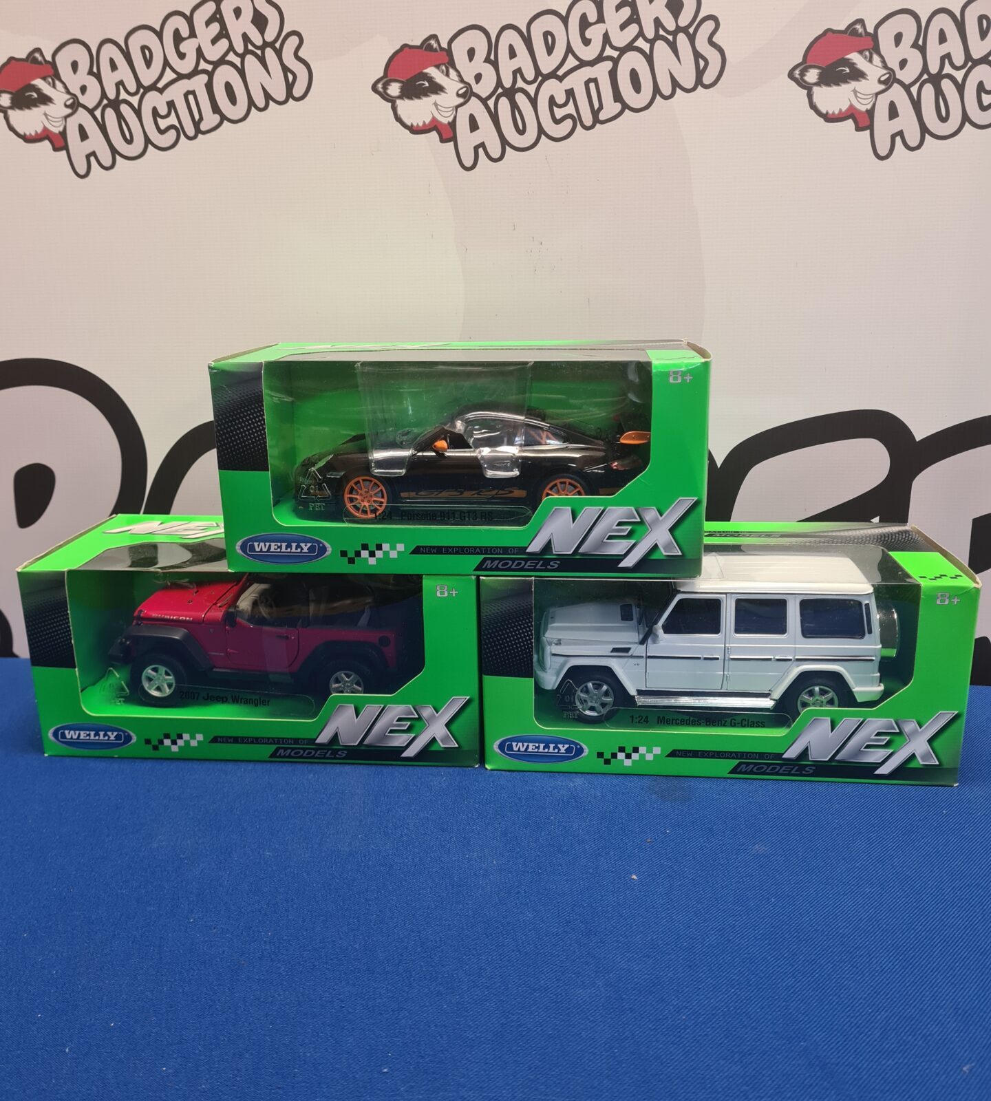 Welly NEX diecast model cars in boxed lot.