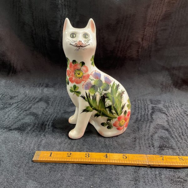 Hand-painted Wemyss Pottery cat by Griselda Hill with floral design.