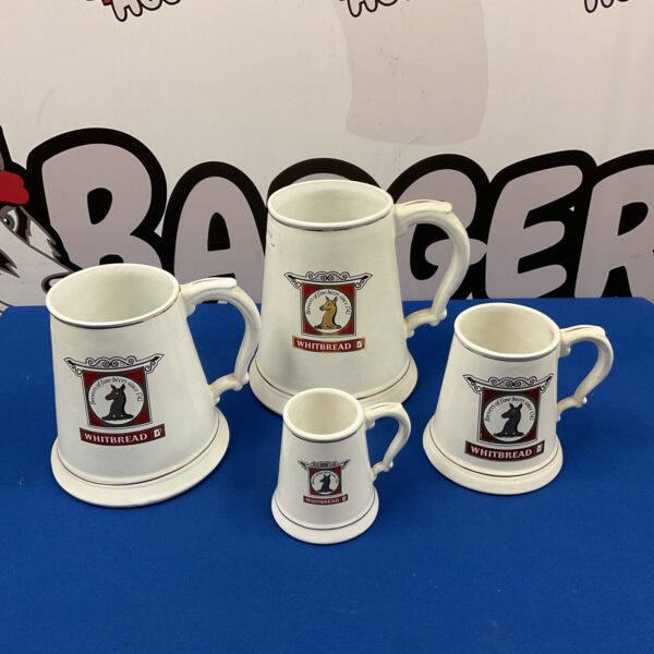 Set of four vintage Whitbread Brewery graduated tankards.