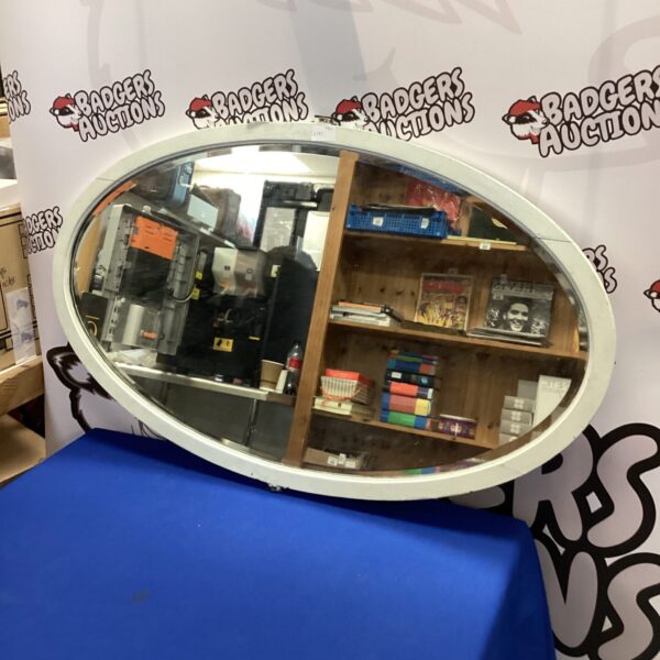 Vintage white oval wall mirror for home decor.
