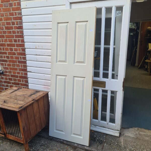 Large white panel door for architectural salvage and restoration.