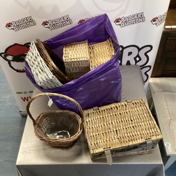 Lot of woven wicker baskets for storage and display.