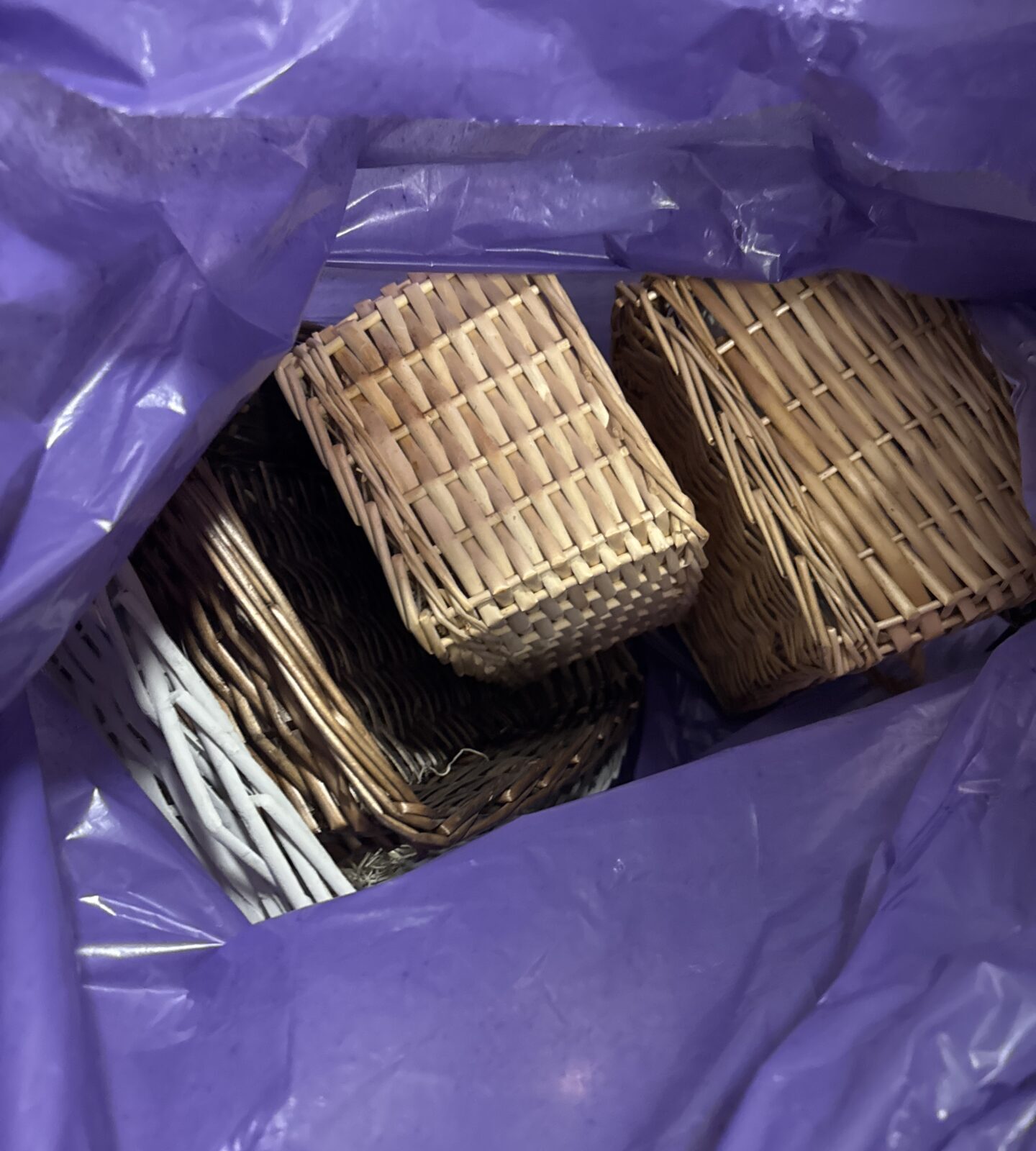 Close-up of several wicker baskets and trays in varying sizes.