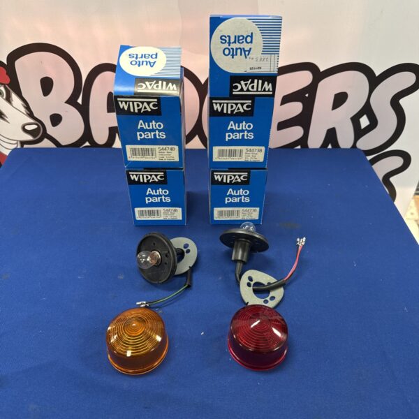 Vintage Wipac rear light assemblies for classic car restoration.