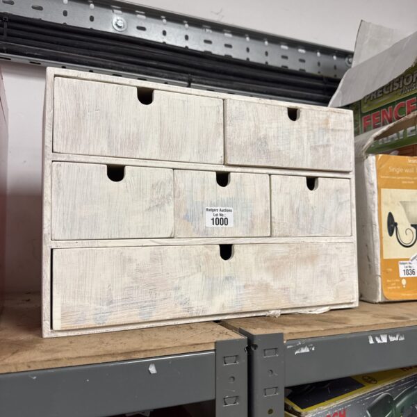 Vintage wooden hobbyist storage cabinet with multiple drawers.