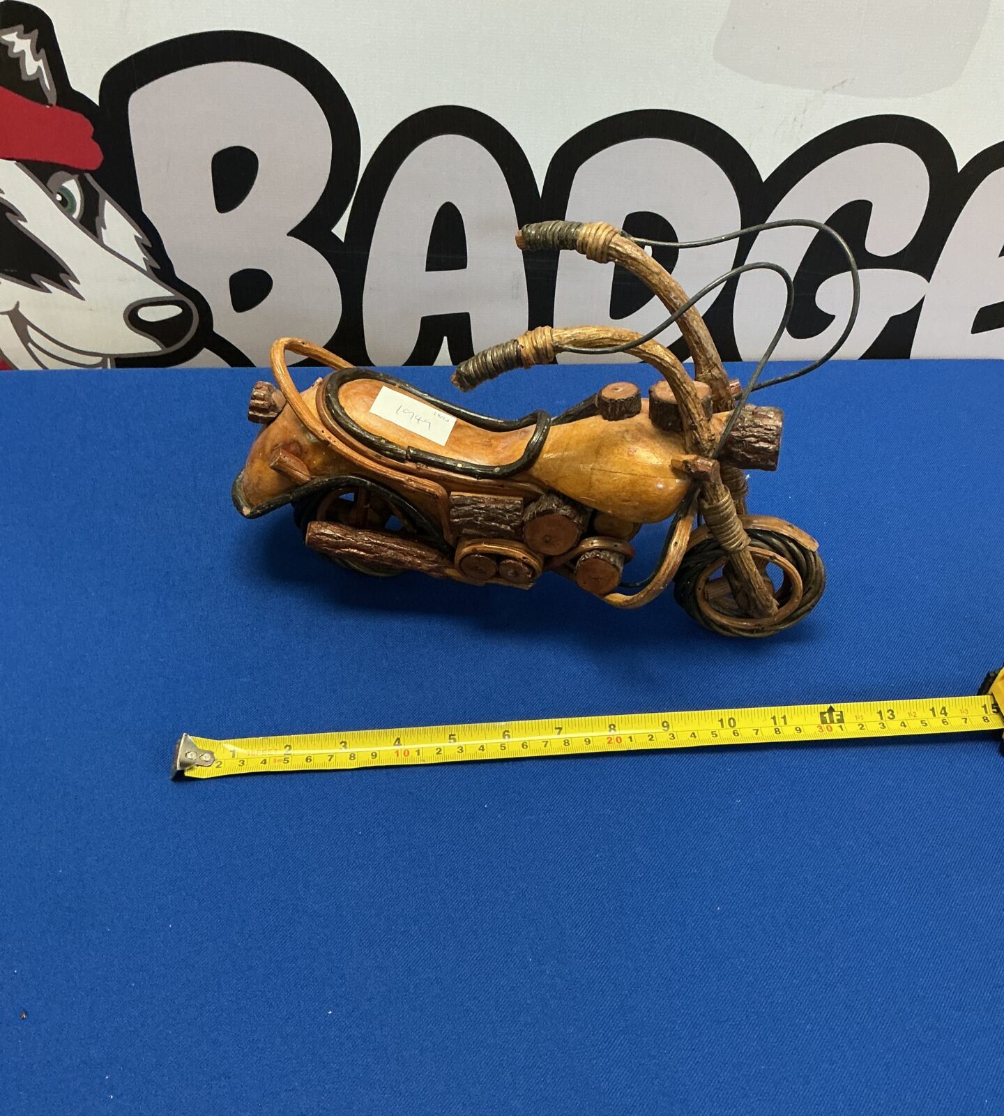 Vintage wooden model motorcycle, detailed carving, collectible item.