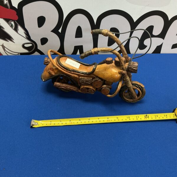 Vintage wooden model motorcycle, detailed carving, collectible item.