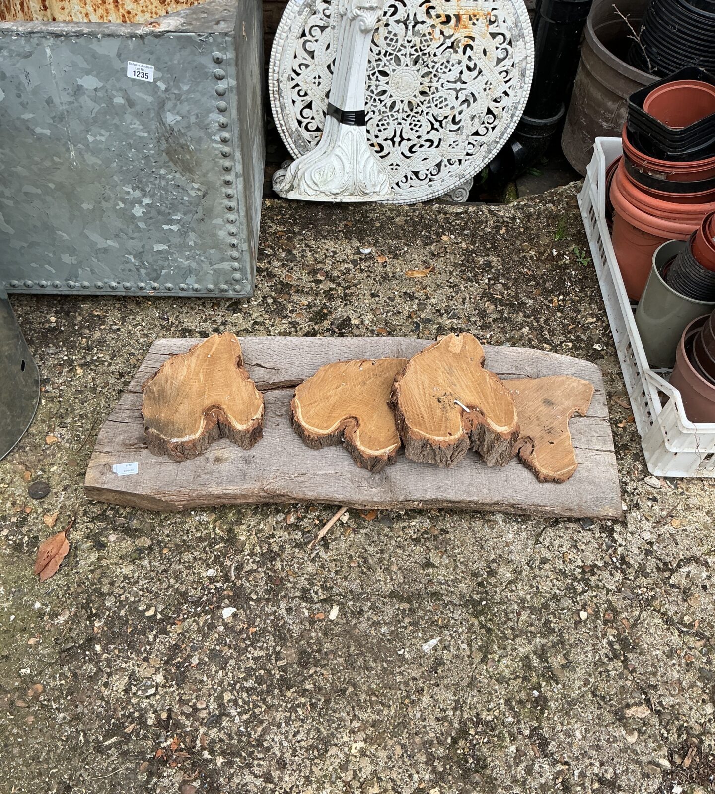 Set of four wooden pot feet for garden planters.