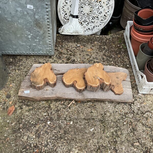 Set of four wooden pot feet for garden planters.