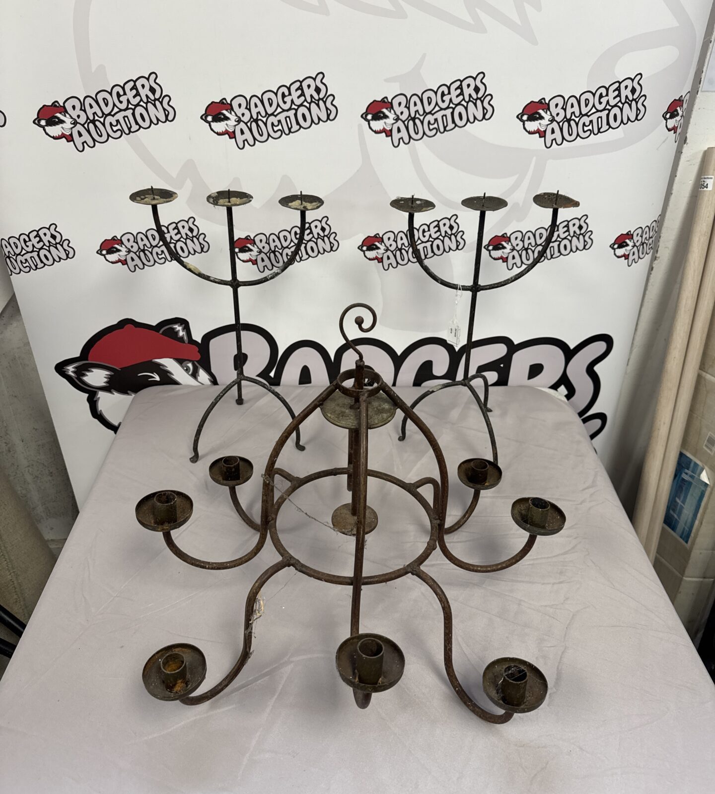 Vintage wrought iron candelabra with two ornate candle holders.