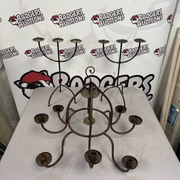 Vintage wrought iron candelabra with two ornate candle holders.