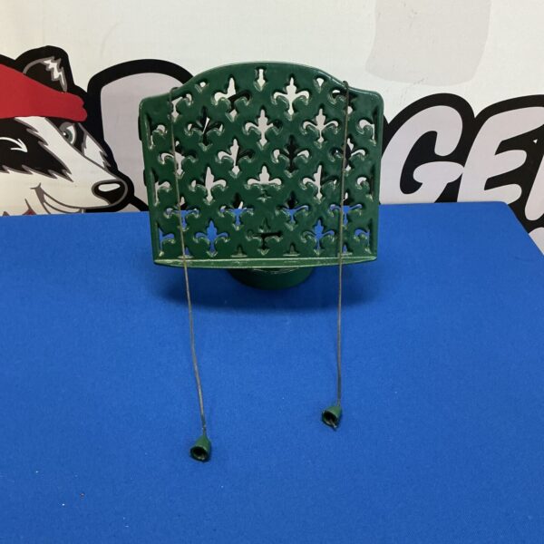 Vintage wrought iron recipe book stand with floral design.