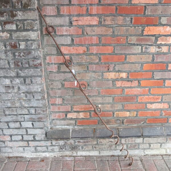 Weathered Ww1 battlefield barbwire post, a historical iron relic.