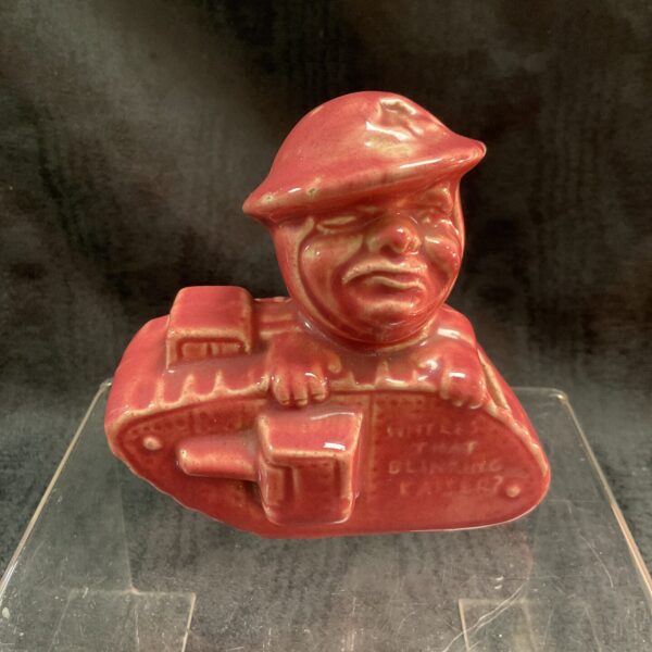 Front view of antique WWI Old Bill tank man figurine.