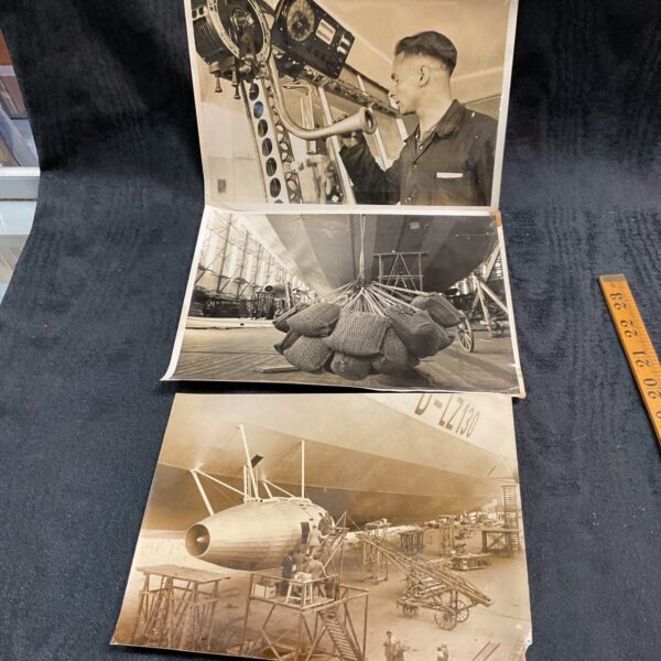 Vintage WWII photograph of a German Zeppelin airship with a man operating equipment.