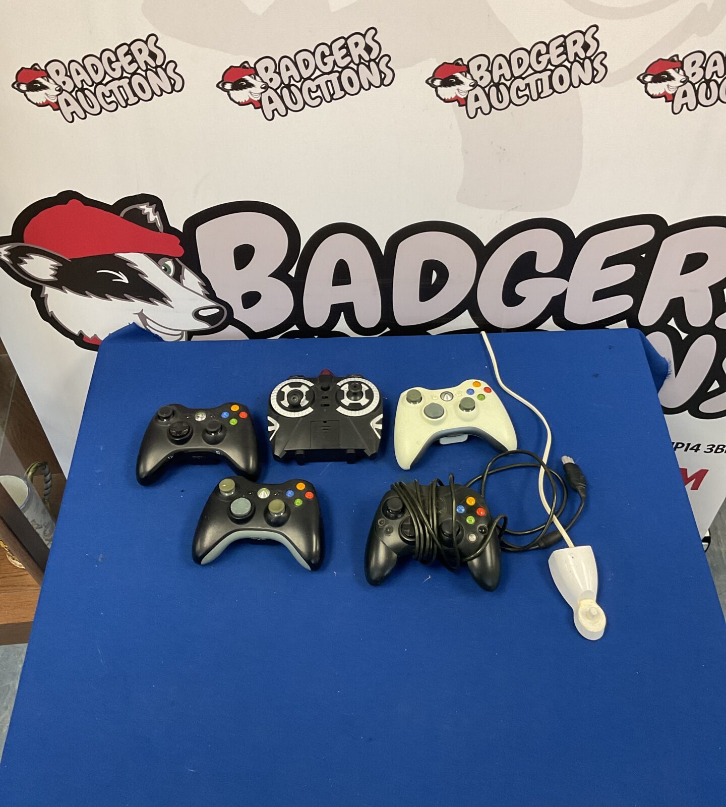 Lot of Xbox 360 controllers and original Xbox controller for gaming.