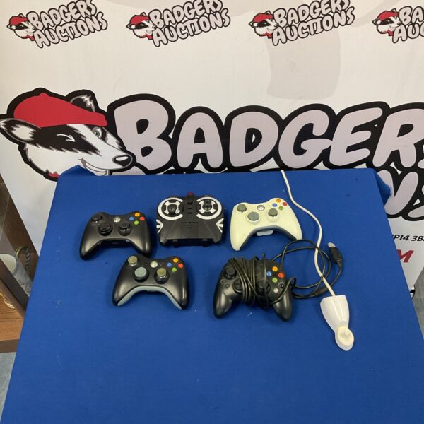 Lot of Xbox 360 controllers and original Xbox controller for gaming.