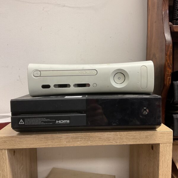 Black Microsoft Xbox 360 E gaming console for retro gaming.