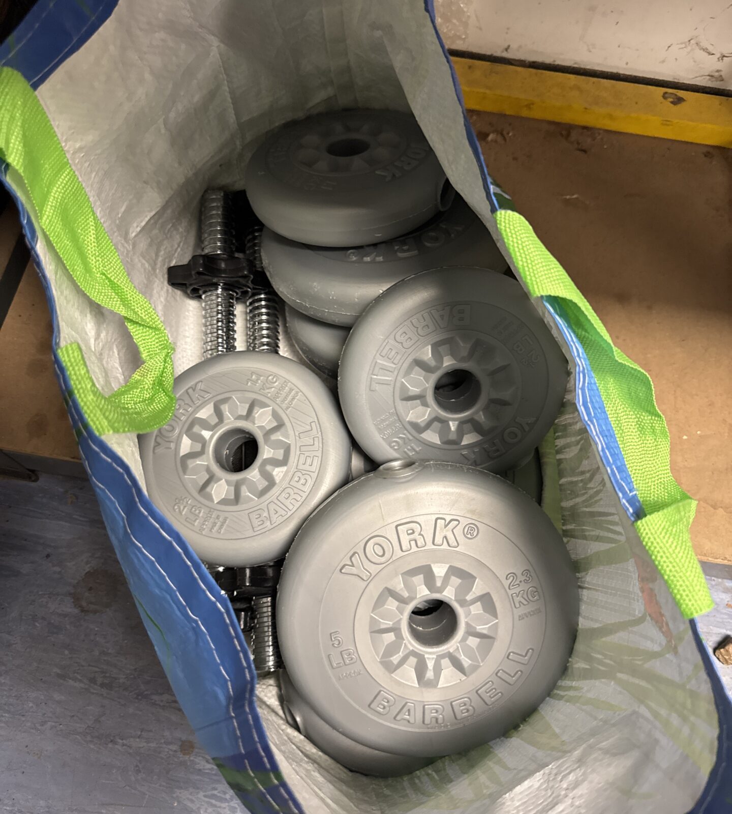 Pair of York vinyl dumbbells in a storage bag.