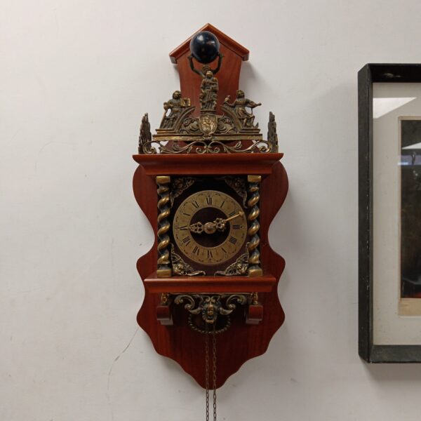 Vintage Zaanse wall clock with weights and pendulum.