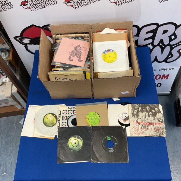 Box of vintage 1970s vinyl singles including Lindsfarne and Pink Floyd.