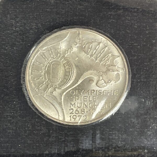 Silver 1972 Munich Olympics coin obverse with Olympic rings.
