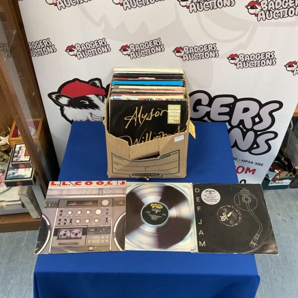 Stack of 1980s vinyl LP records and 12 inch singles.