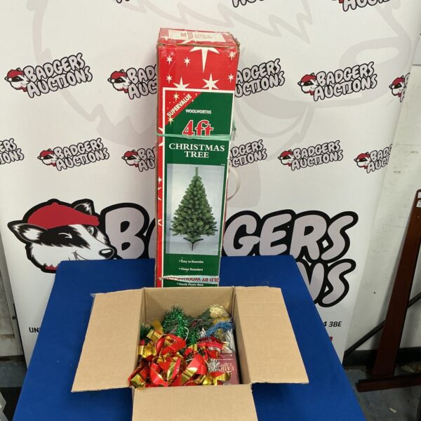 Decorated 4ft artificial Christmas tree for festive holiday display.