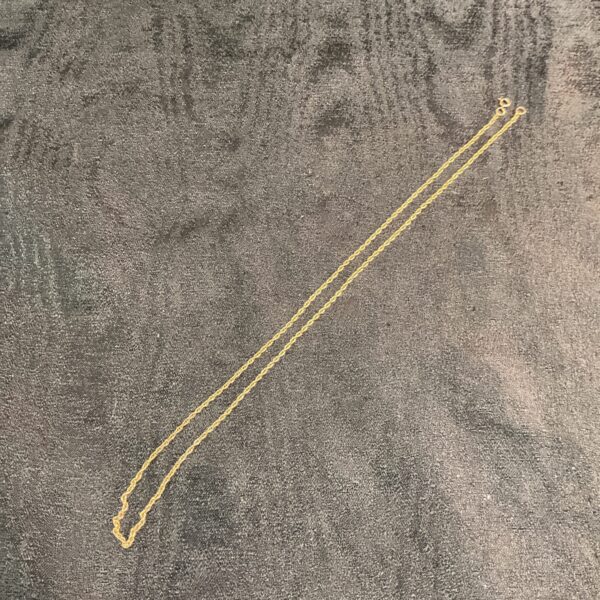Delicate 9 carat gold necklace, hallmarked and 20 inches long.