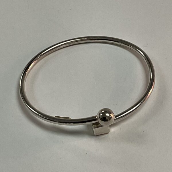 Close-up of 925 silver cube and ball bracelet with minimalist design.