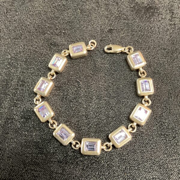 Elegant 925 silver bracelet with light blue stones.