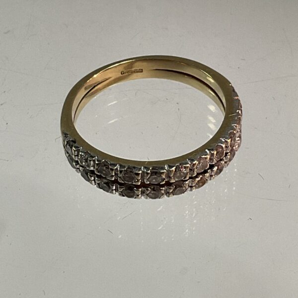 Elegant 9ct gold diamond ring with a continuous band.