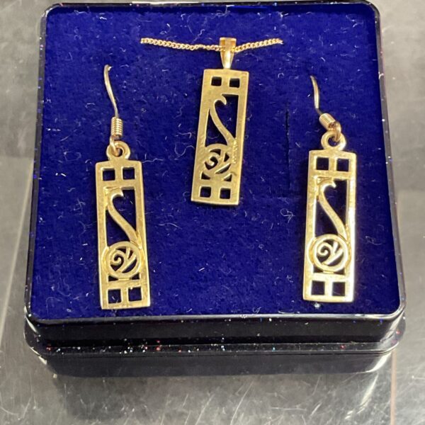 9ct gold necklace and earrings set displayed on a dark background.