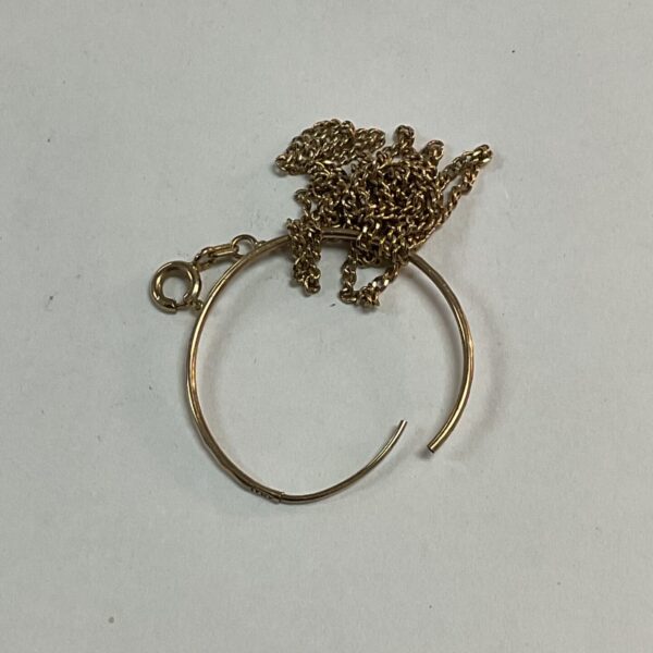 Close-up of 9ct gold scrap fragment for jewellery making.