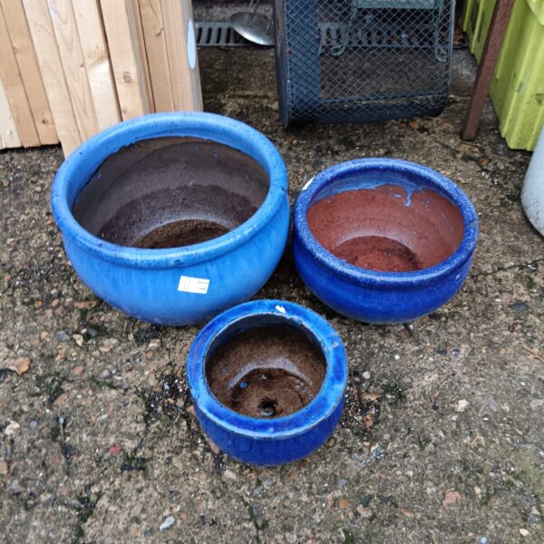 Set of three blue glazed garden pots